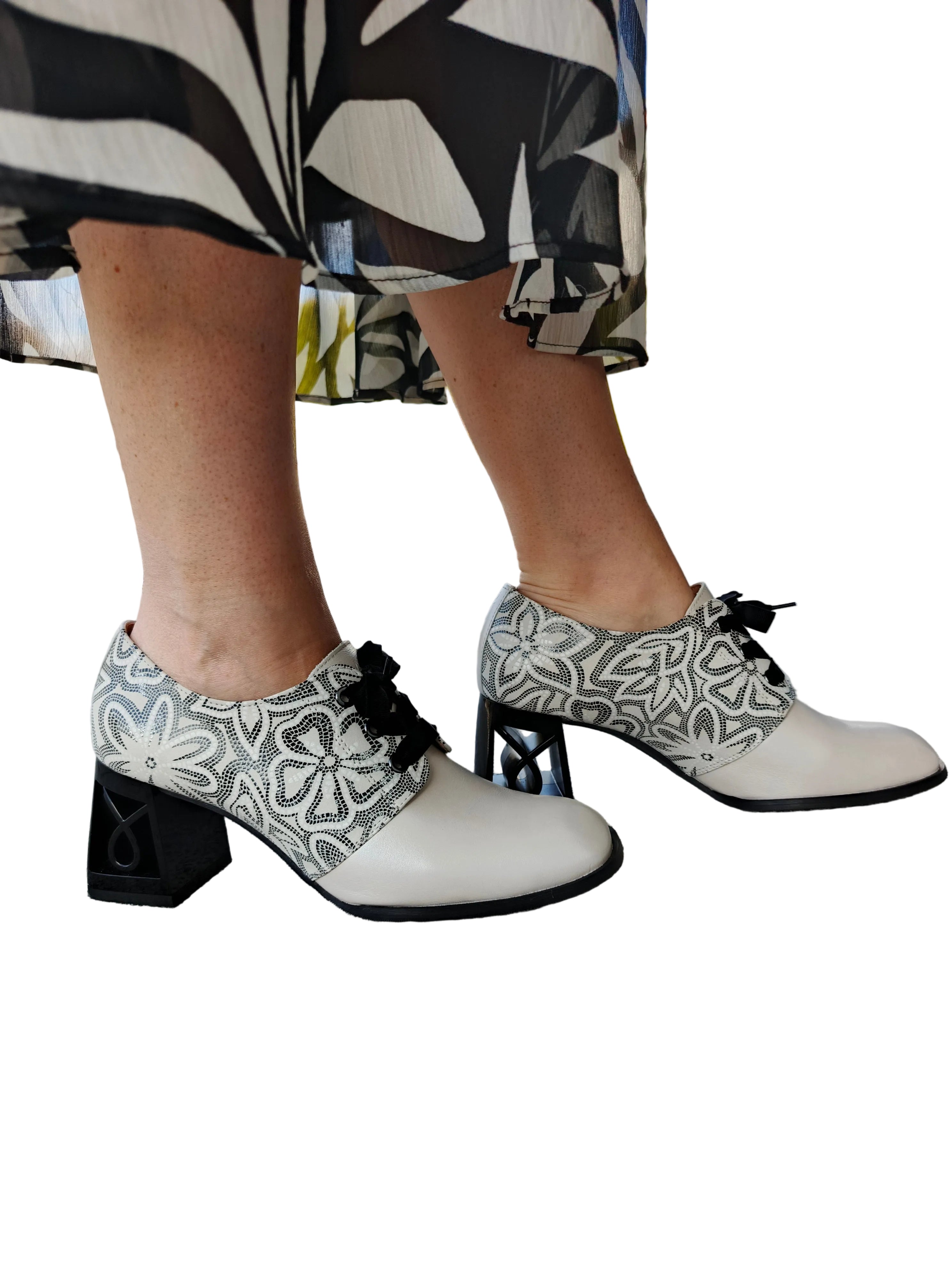 Women's handmade leather shoes with floral pattern, block heels, outdoor setting
